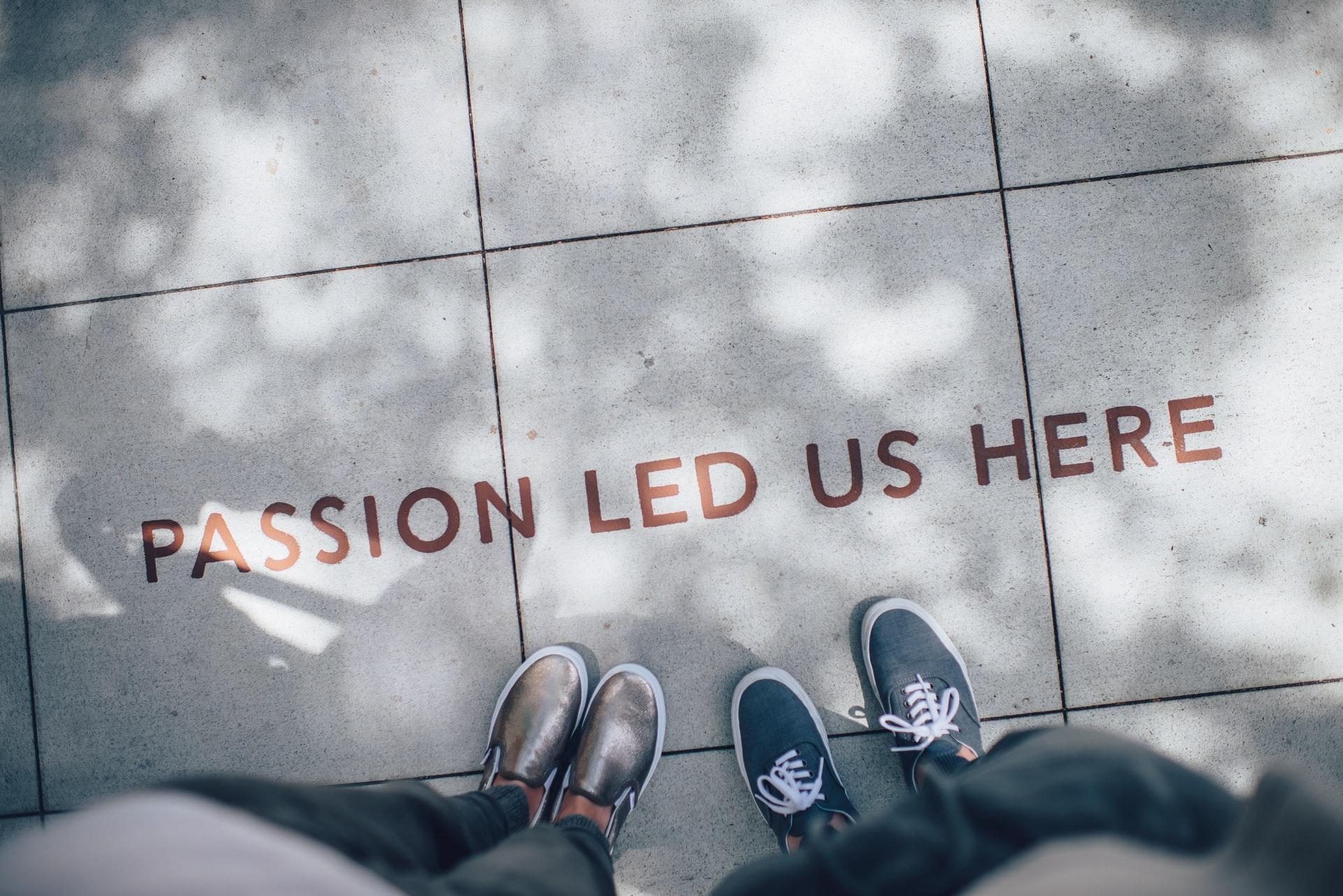 Sidewalk with text "Passion Led Us Here"